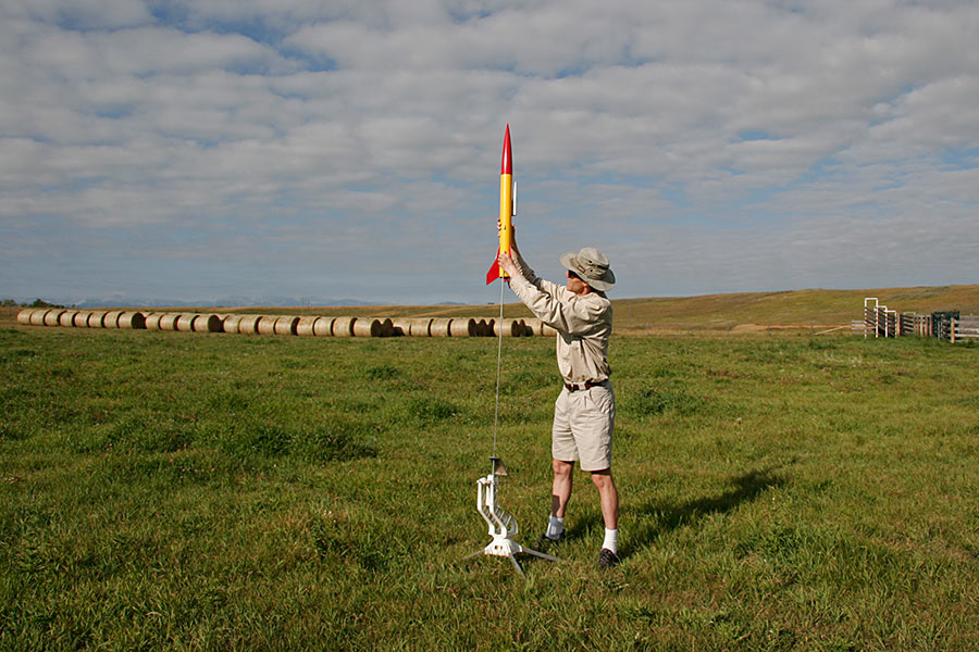 The rocket is lowered onto the launch rod...
