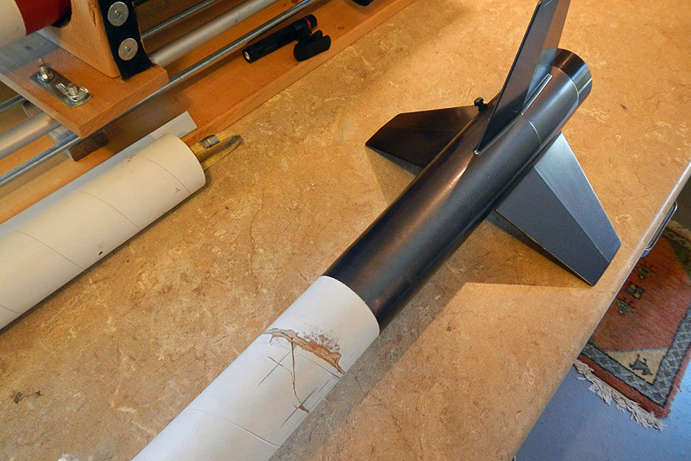 the consequence of adding an internal coupler to the airframe meant that <br />it would no longer be able to fit a 54mm motor tube, so a 38mm adapter <br />was test fitted to make sure it fit with the coupler...