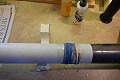 the coupler was epoxied and slid into place with additional epoxy added <br />to the seams and wrapped with elastics to ensure a tight fit...