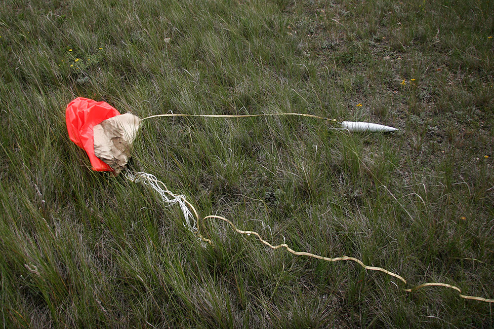unfortunately, the nomex blanket used as a heat shield <br />slid up the shrouds and prevented the main chute <br />from completely inflating...
