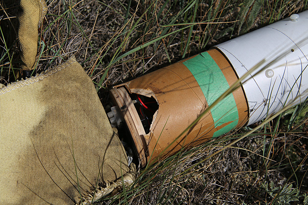 the av-bay also hit hard. After examination, it didn't seem as though <br />the deployment charge could have caused the bay to shatter, <br />so the only other conclusion is that it broke on landing...