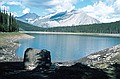 Looking back across Hidden Lake at the point where the trail enters the forest. Mt. Indefatigable in the distance.