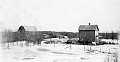 Early photo of "The Bush", near Pilot Mound, Manitoba, taken before the <br />farm house was covered with insulated brick c.1930's