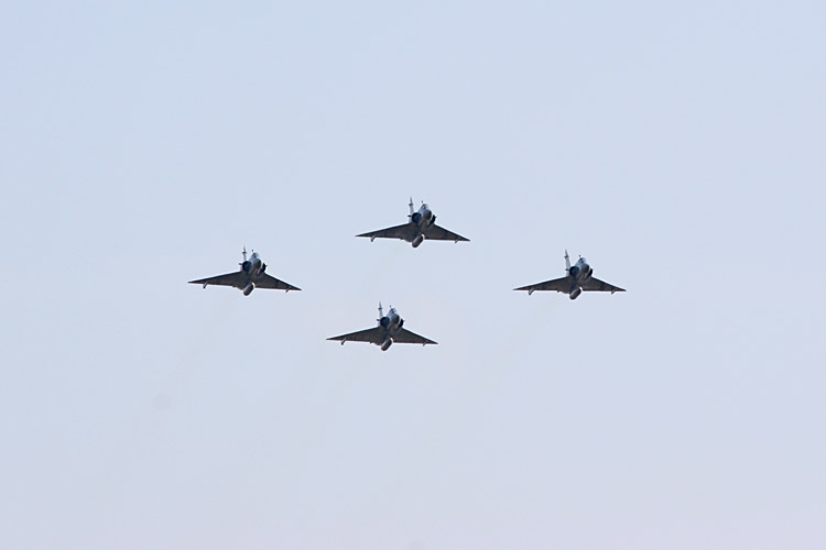 And to mark the end of the ceremony, a dramatic flyover by four French Mirage fighters...